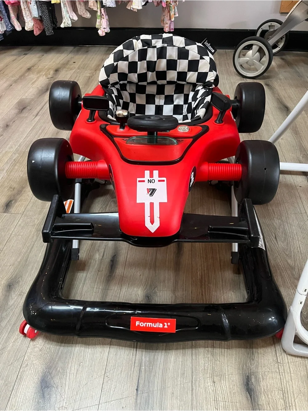 4-in-1 Baby Walker features a race car design with a checkered seat.